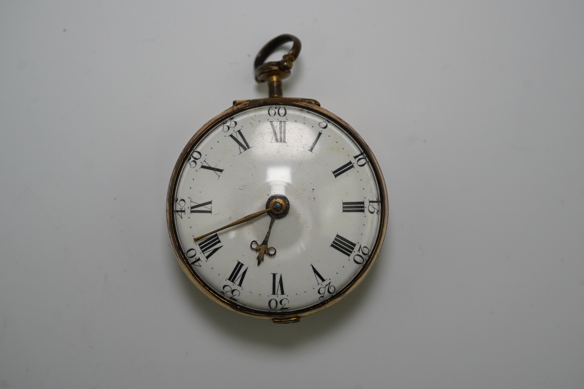 A George III pair cased gold plated pocket watch, with a green stained tortoiseshell outer case, by William Hope, London